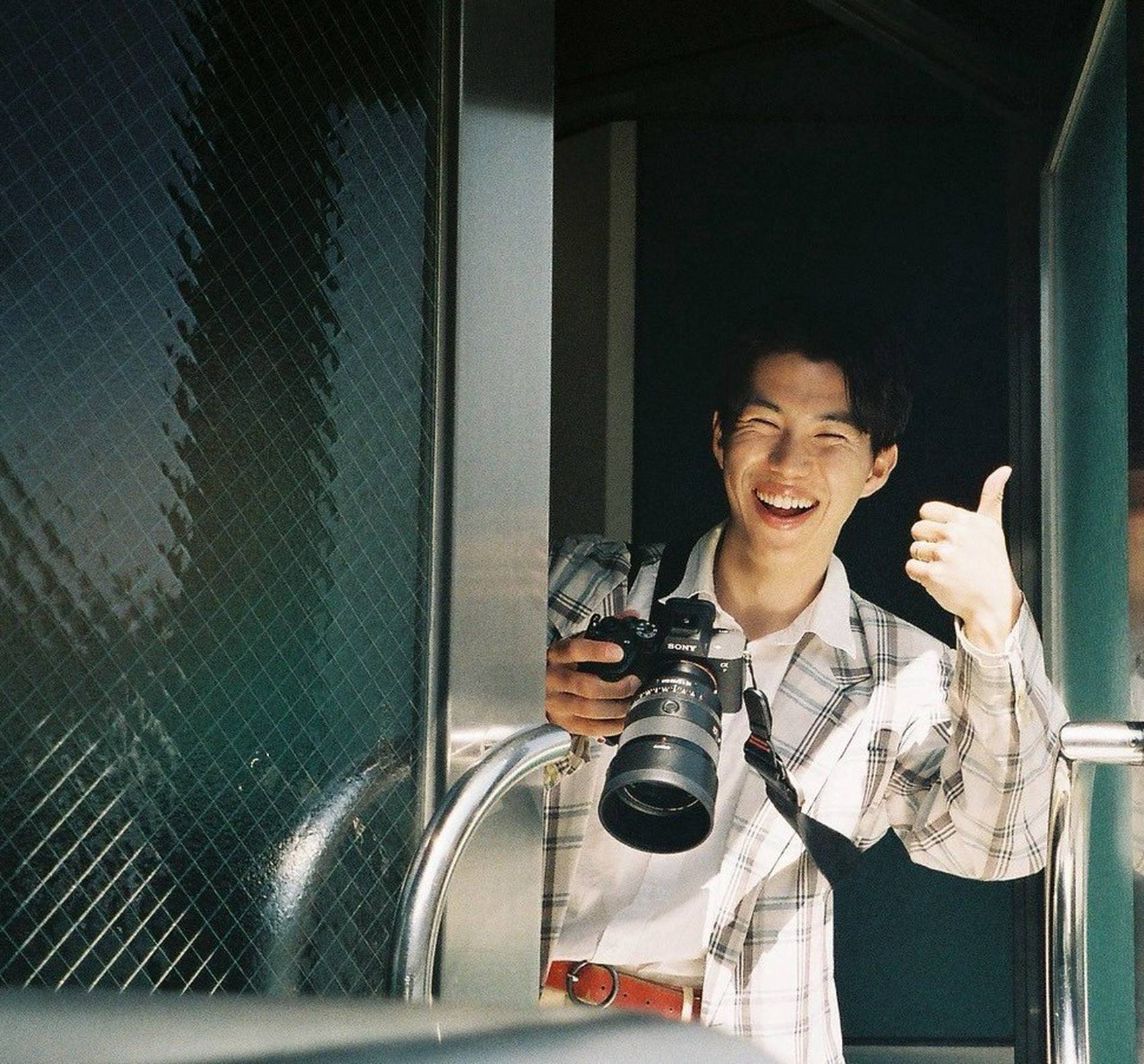 Masa on a shoot, giving a thumbs up