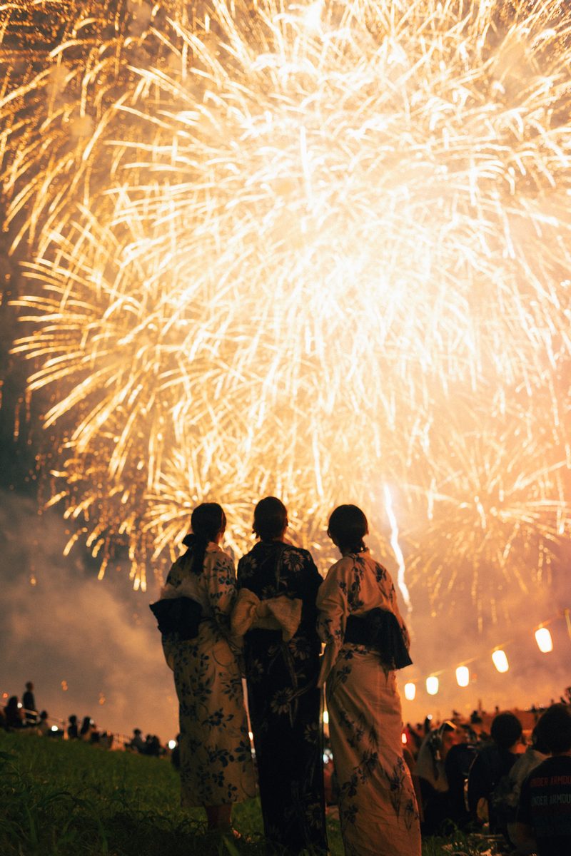 Friends under the fireworks in Tokyo