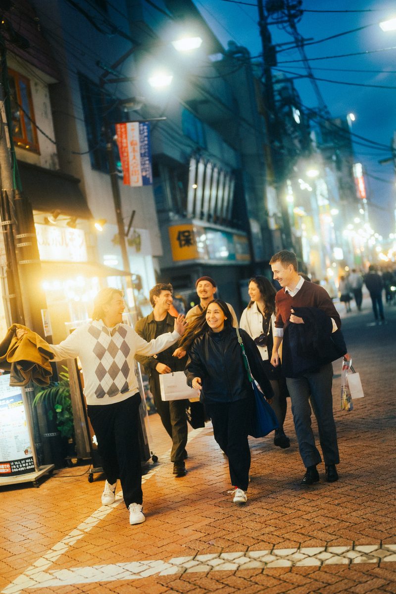 Friends in the neon night in Tokyo