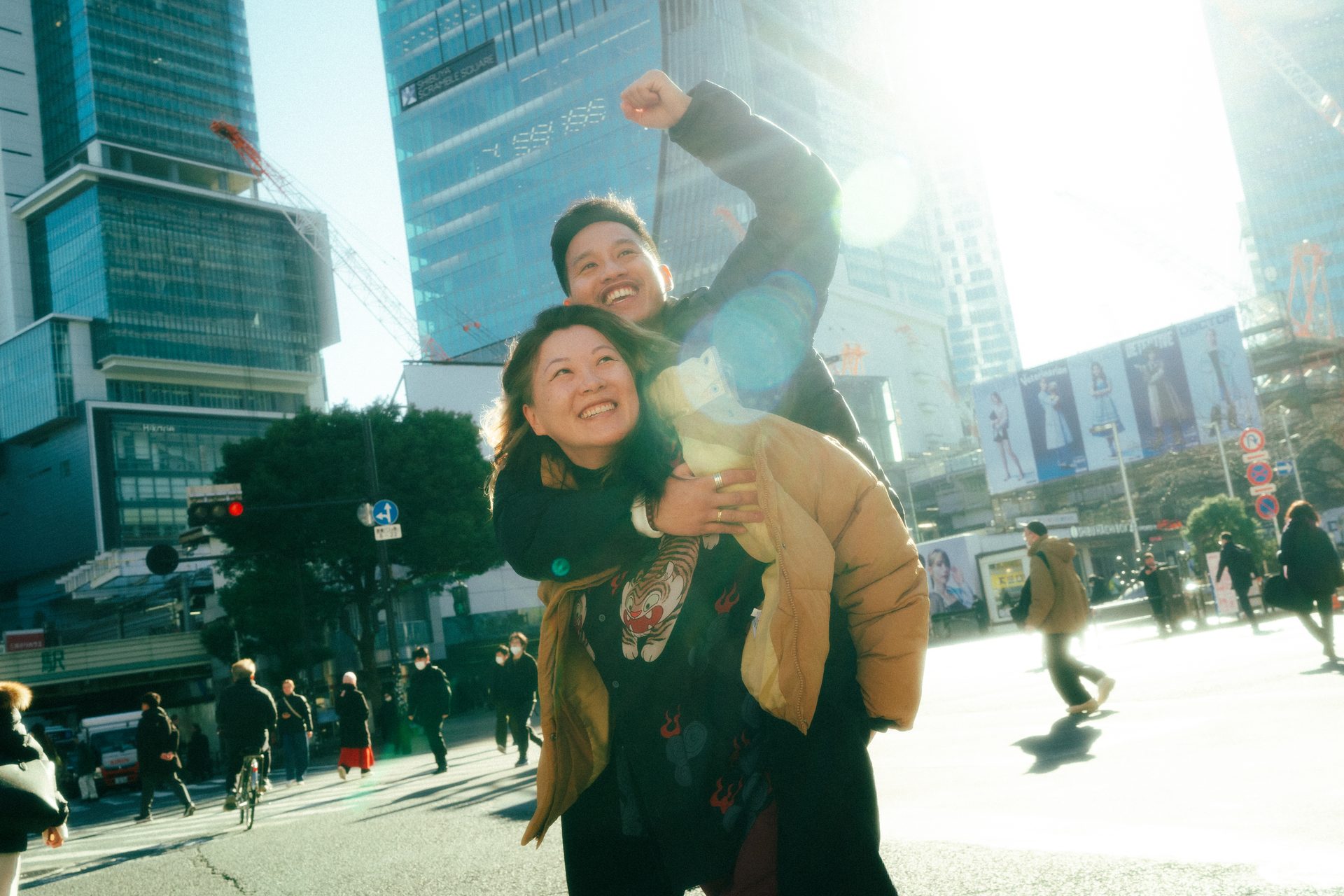 A couple laughing in the winter light in Tokyo