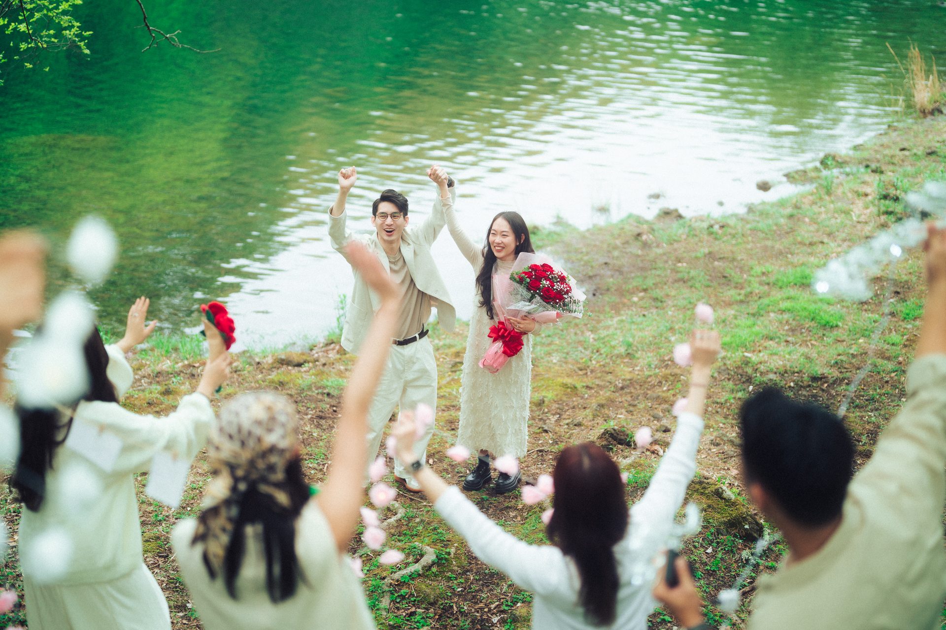 Petals in the air by the water