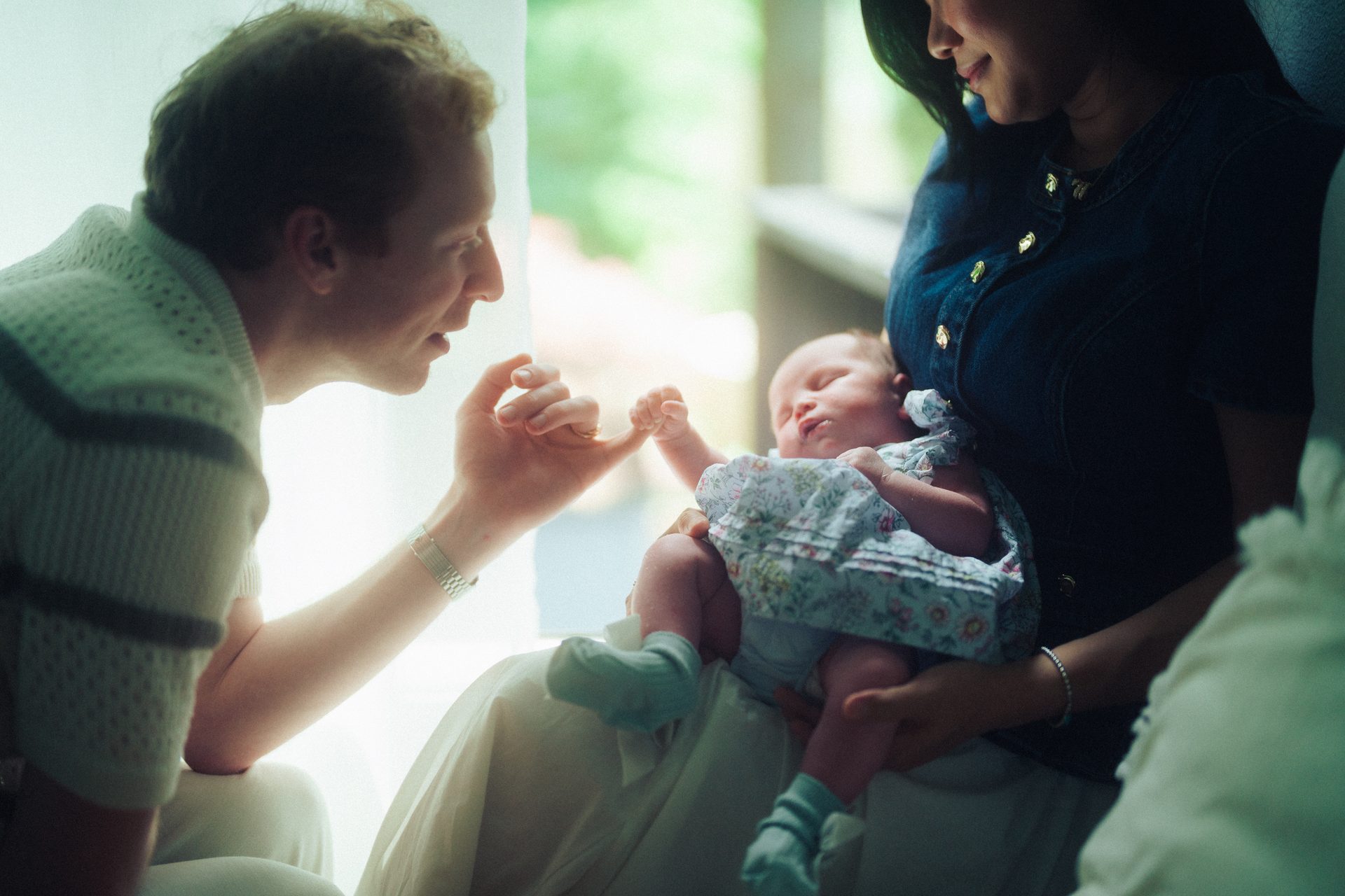 A grandfather meeting the baby
