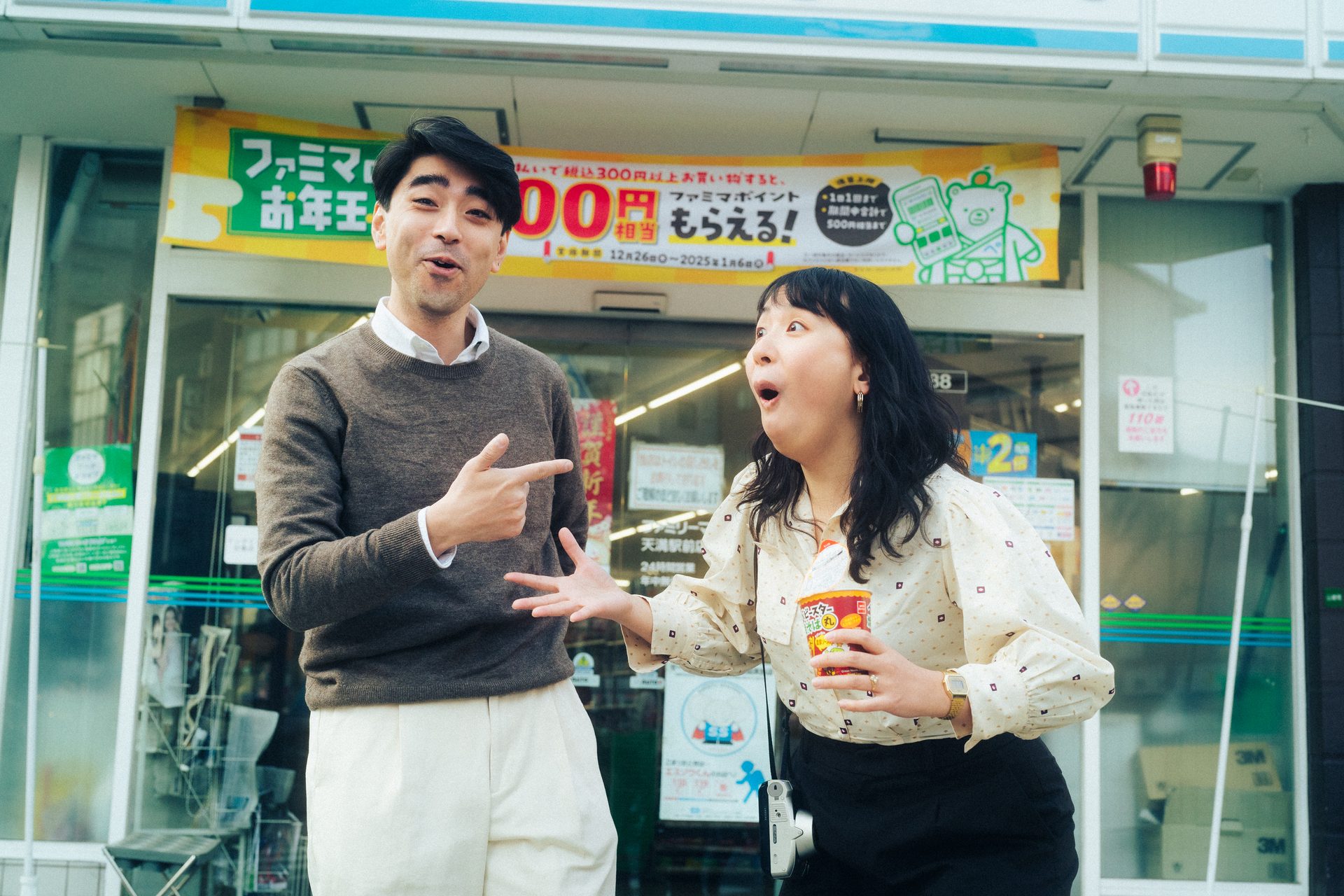 Drinks in hand outside a corner shop