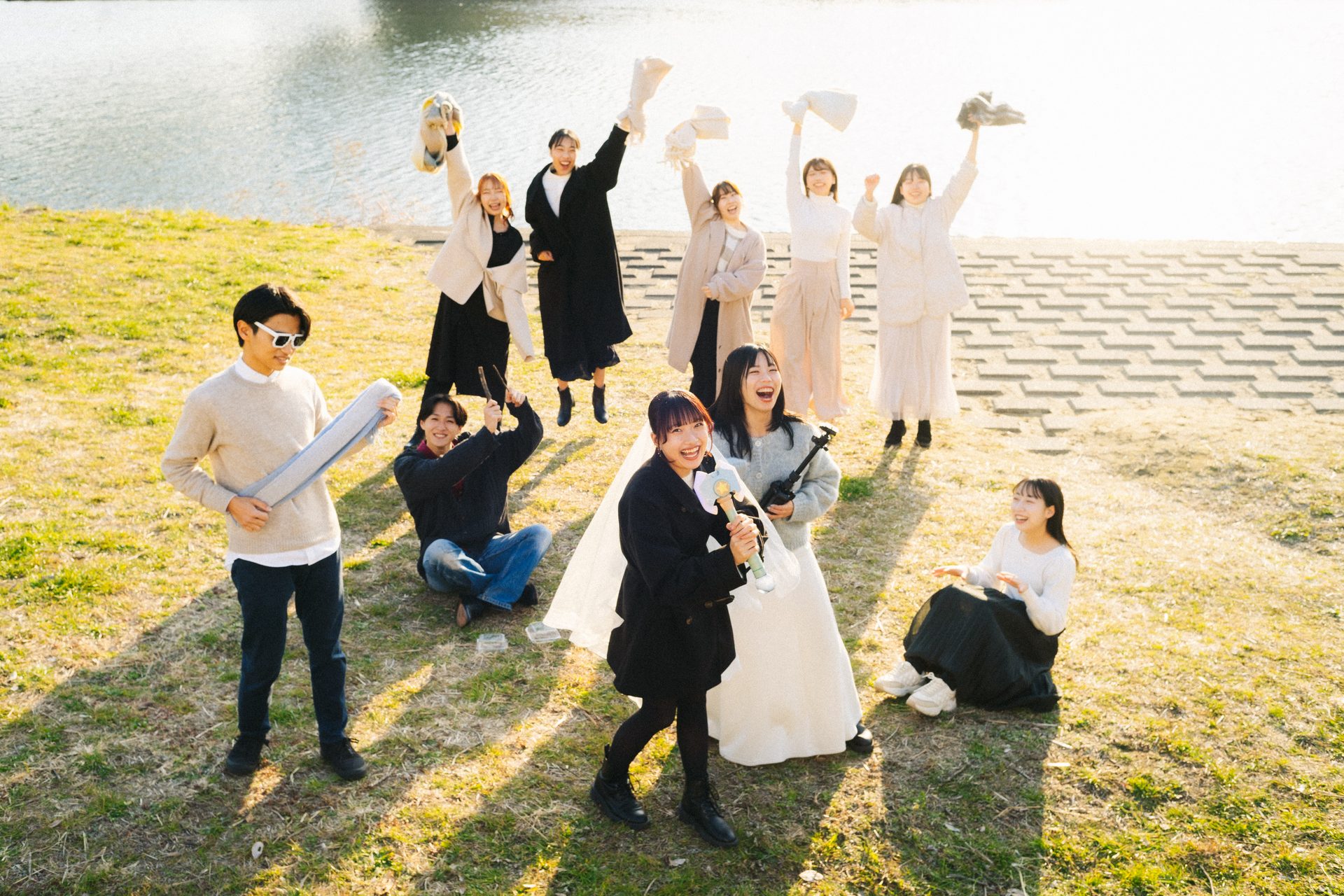 Everyone falling over laughing on the grass